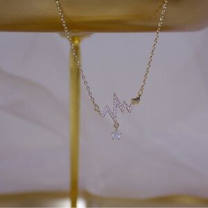 Elegant Gold Lightning Heart Necklace with Clear Cubic Zirconia